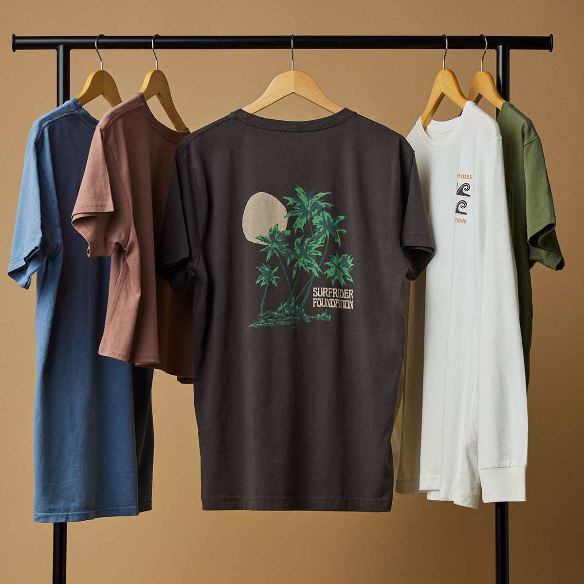 Surfrider t-shirts hanging on rack