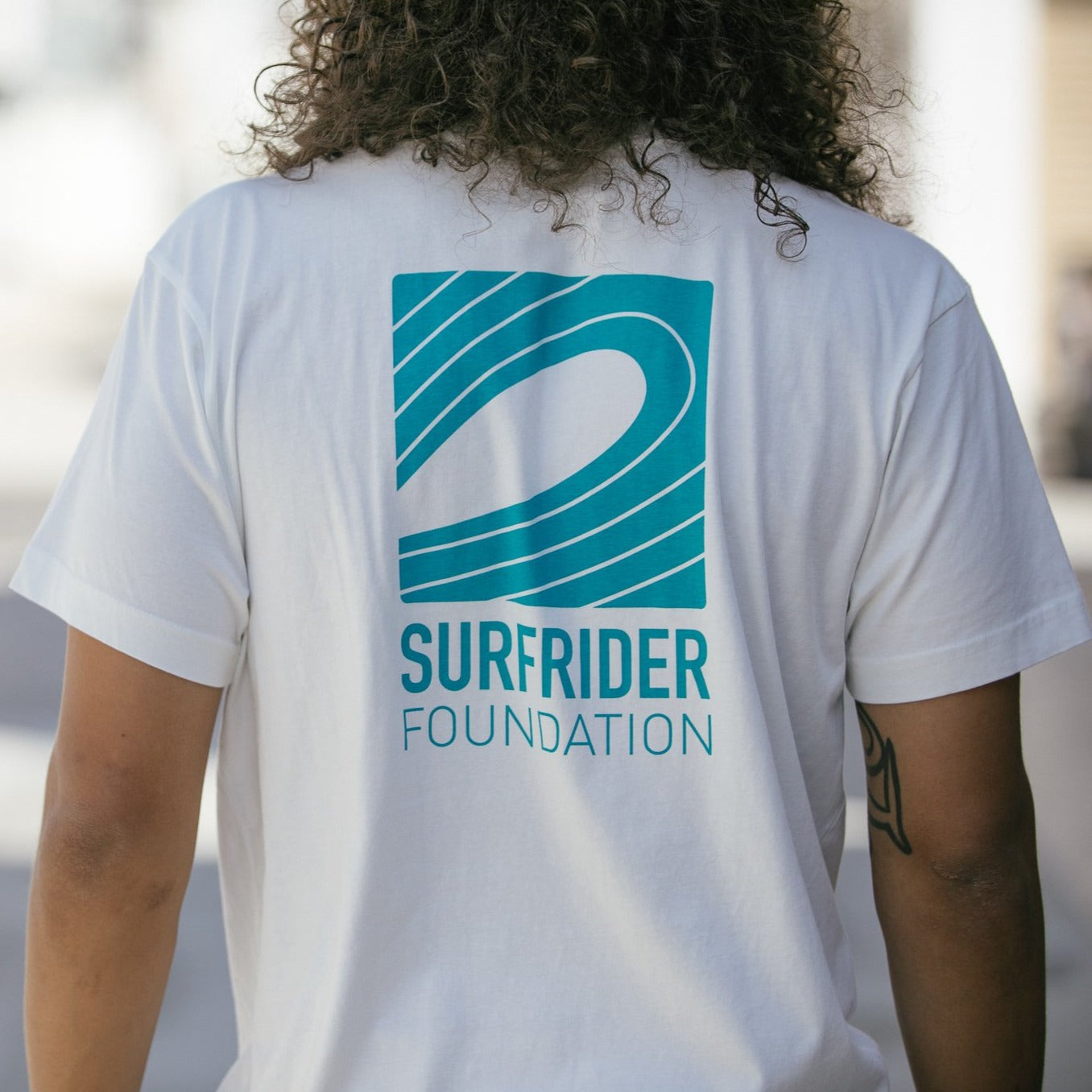 Back logo detail on tee.