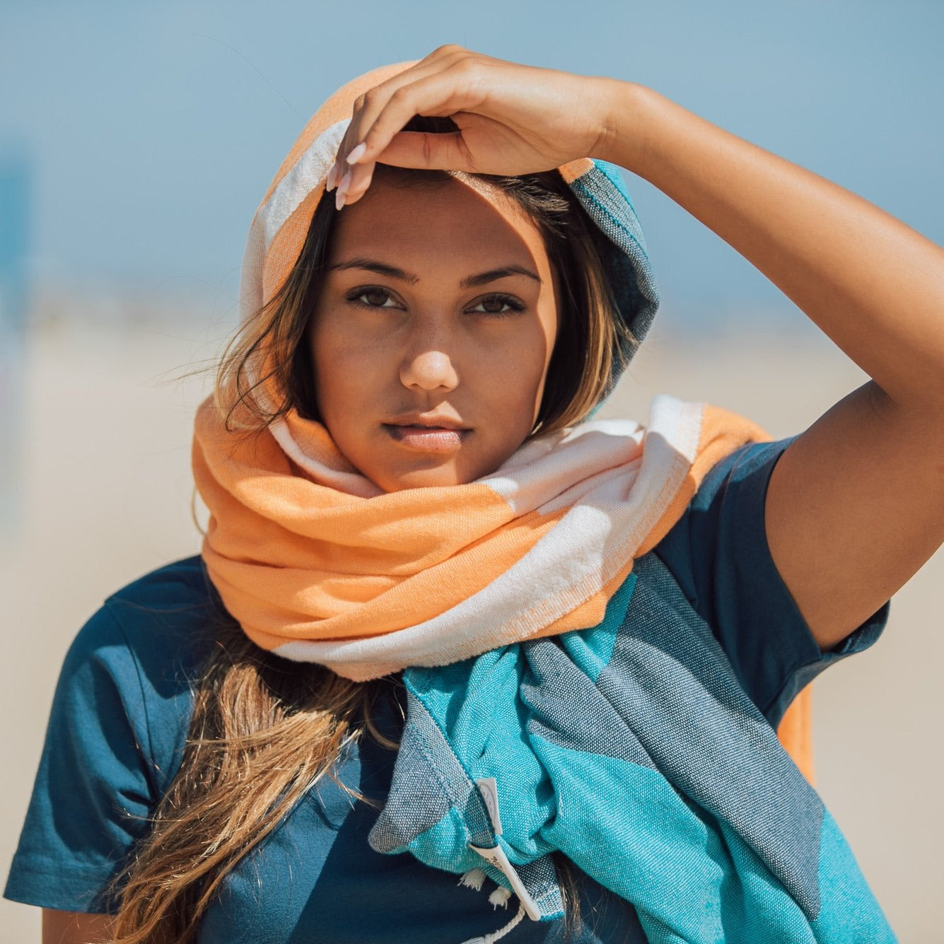 Detail of the towel wrapped as a scarf on model. 