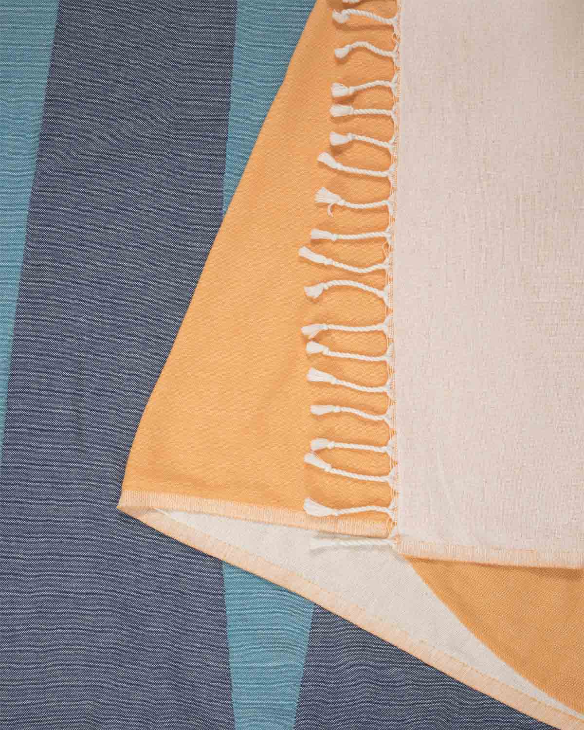 Details of the tassel trim on the towel. 